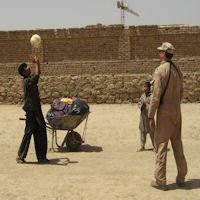 Man takes time to play some ball after collecting his share of what we handed out